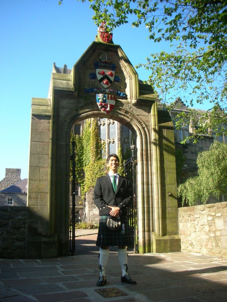 Donning on a kilt for graduation at the University of Aberdeen